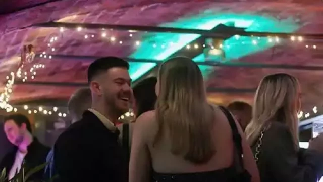 People chatting at a party in Liverpool